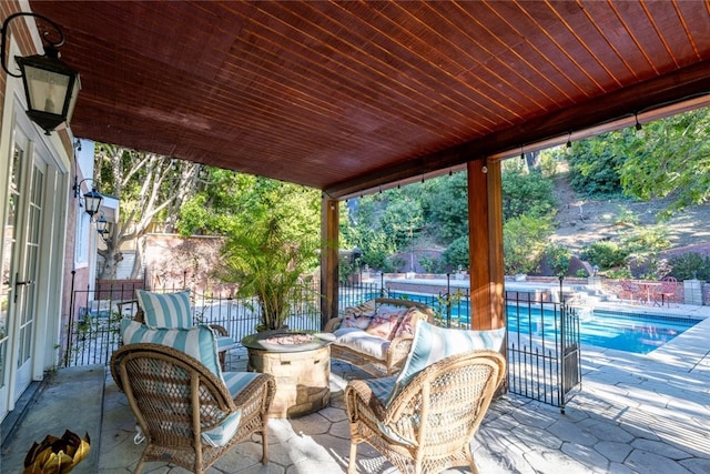 view of patio / terrace with a fenced in pool