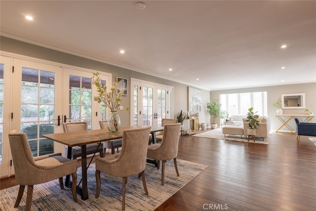 dining room featuring french doors, dark hardwood / wood-style flooring, and crown molding