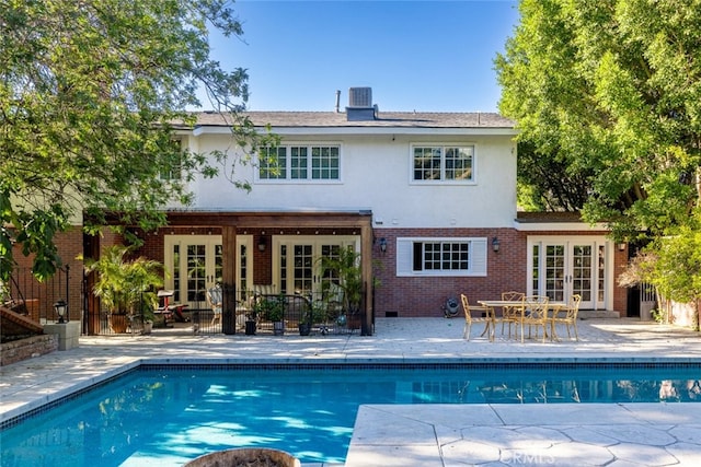 back of property featuring french doors, an outdoor hangout area, central AC, and a patio area