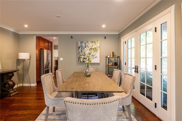 dining room with french doors, dark wood-type flooring, and ornamental molding