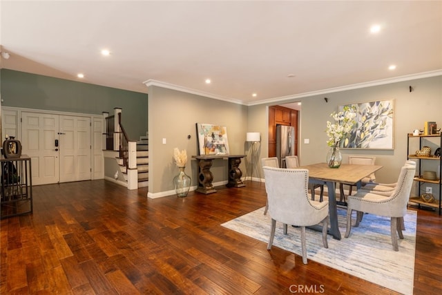 dining room featuring dark hardwood / wood-style floors and crown molding