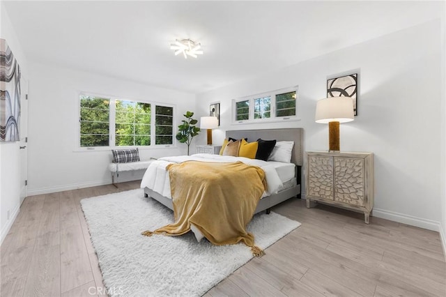 bedroom with light wood-type flooring