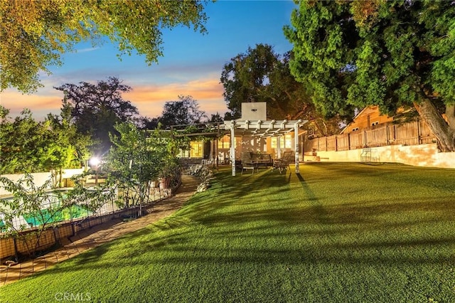 yard at dusk with a pergola