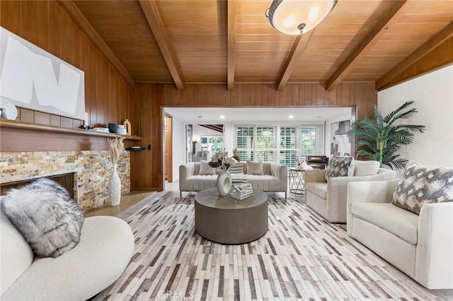 living room featuring wood walls, beamed ceiling, and wood ceiling