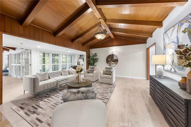 living room with vaulted ceiling with beams, light hardwood / wood-style floors, and wood ceiling