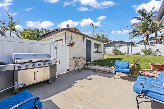 view of patio with a fenced backyard and grilling area