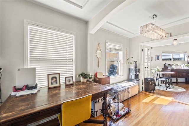 home office with ornamental molding, beam ceiling, and hardwood / wood-style flooring