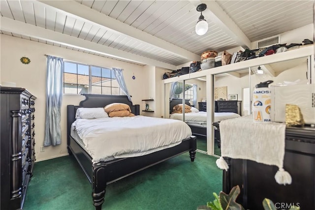 bedroom featuring wooden ceiling, visible vents, dark carpet, and beamed ceiling