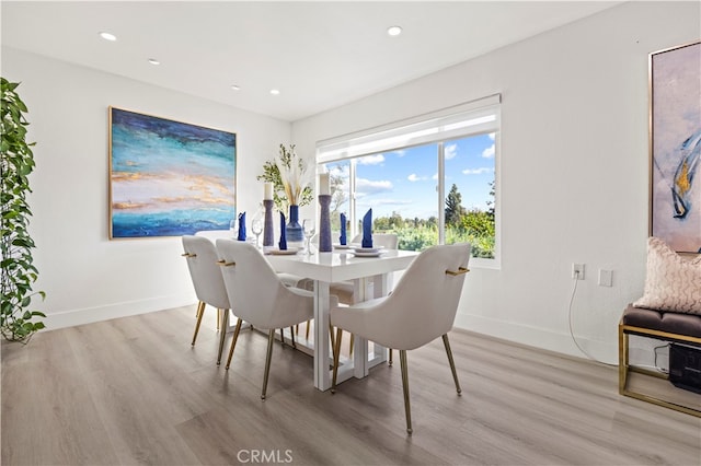 dining space featuring light hardwood / wood-style floors