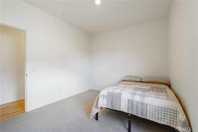 bedroom with hardwood / wood-style floors