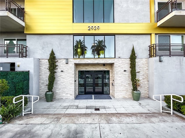 doorway to property featuring french doors and a balcony