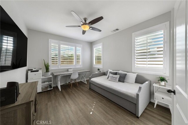 bedroom featuring dark wood-type flooring and ceiling fan