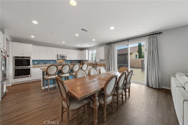 dining room featuring dark wood-type flooring