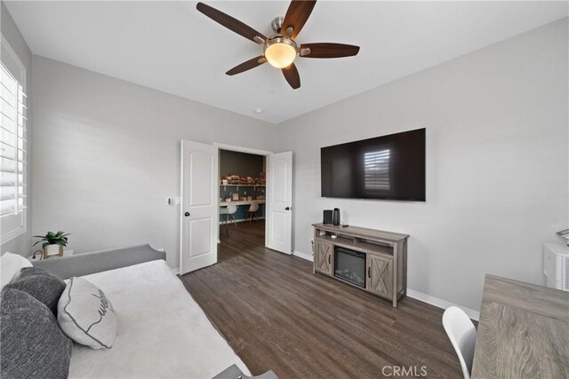 bedroom featuring dark wood-type flooring and ceiling fan