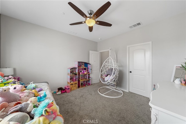 game room with ceiling fan and carpet