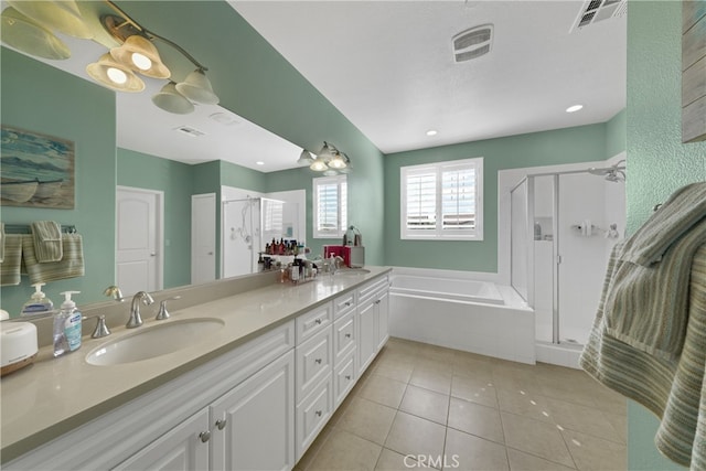 bathroom featuring vanity, independent shower and bath, and tile patterned floors