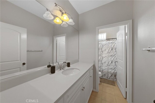 bathroom with vanity, a shower with shower curtain, toilet, and tile patterned floors