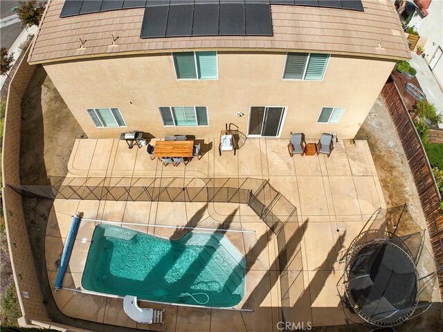 exterior space featuring a jacuzzi