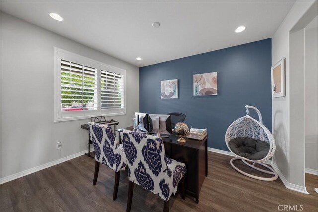 dining area featuring dark wood-type flooring