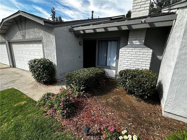 doorway to property featuring a garage