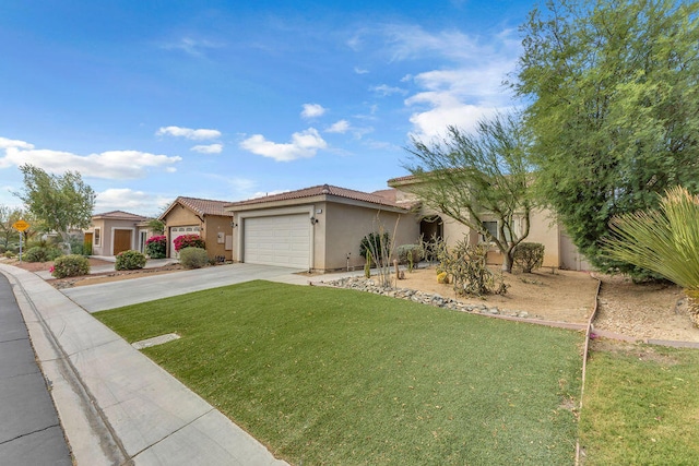 view of front of home featuring a front yard and a garage