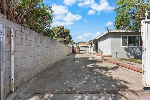 view of side of home with a patio