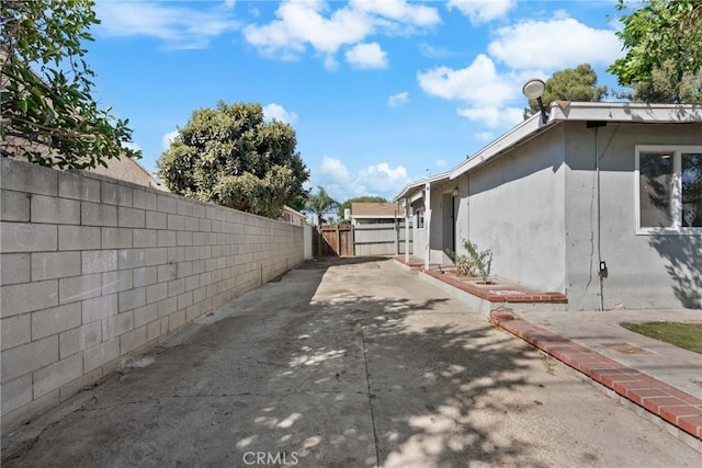 view of property exterior with a patio