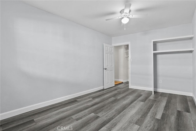 unfurnished bedroom with ceiling fan, dark hardwood / wood-style floors, and a closet