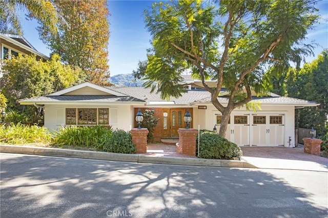 single story home featuring a garage