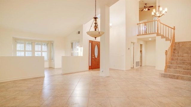 interior space with high vaulted ceiling and ceiling fan