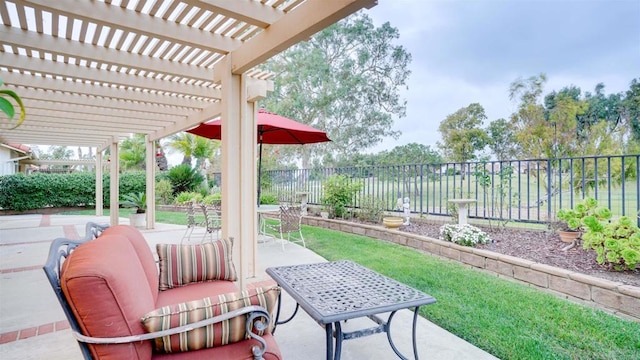 view of patio / terrace featuring a water view and a pergola