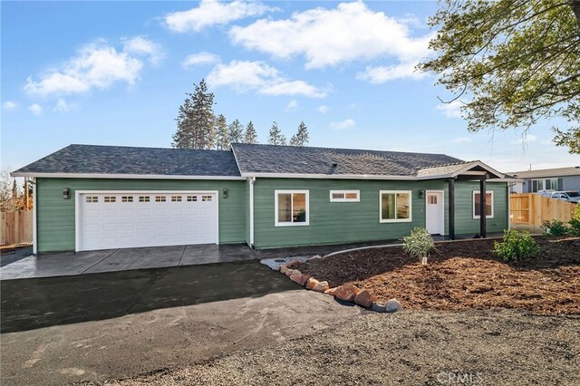 ranch-style home featuring a garage