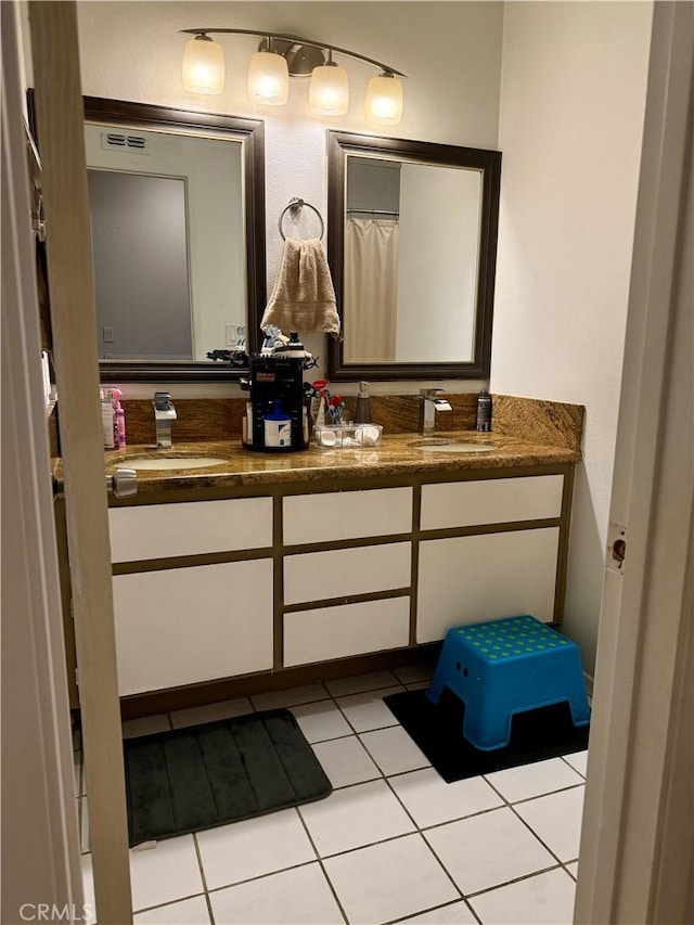 bathroom featuring vanity and tile patterned floors