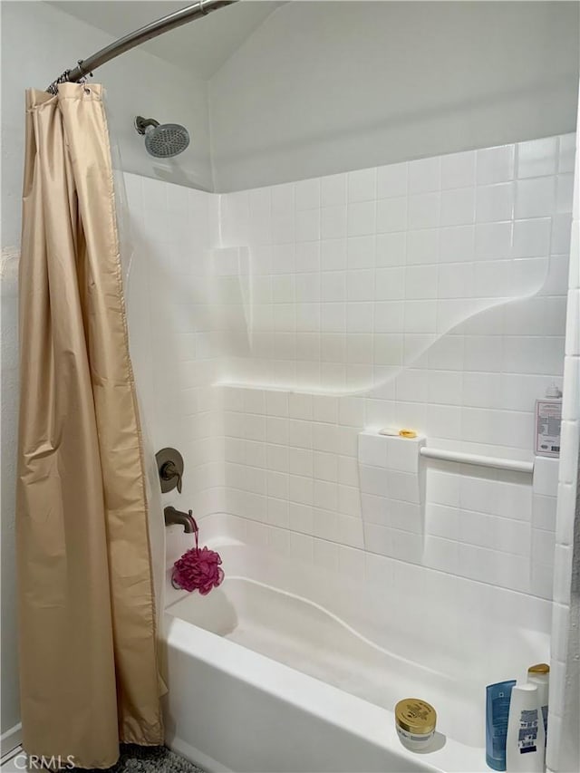 bathroom featuring shower / bath combination with curtain