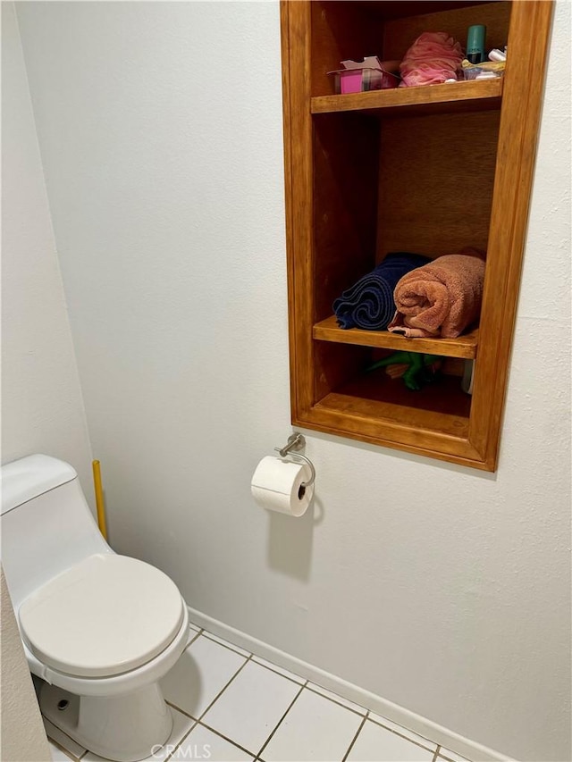 bathroom featuring tile patterned flooring and toilet