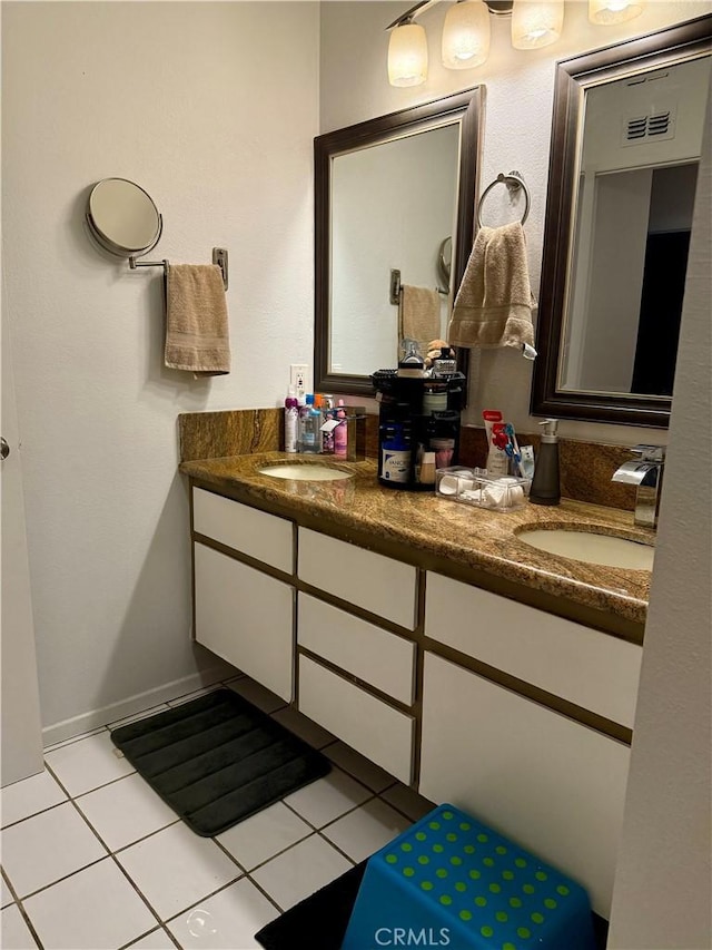 bathroom featuring tile patterned flooring and vanity