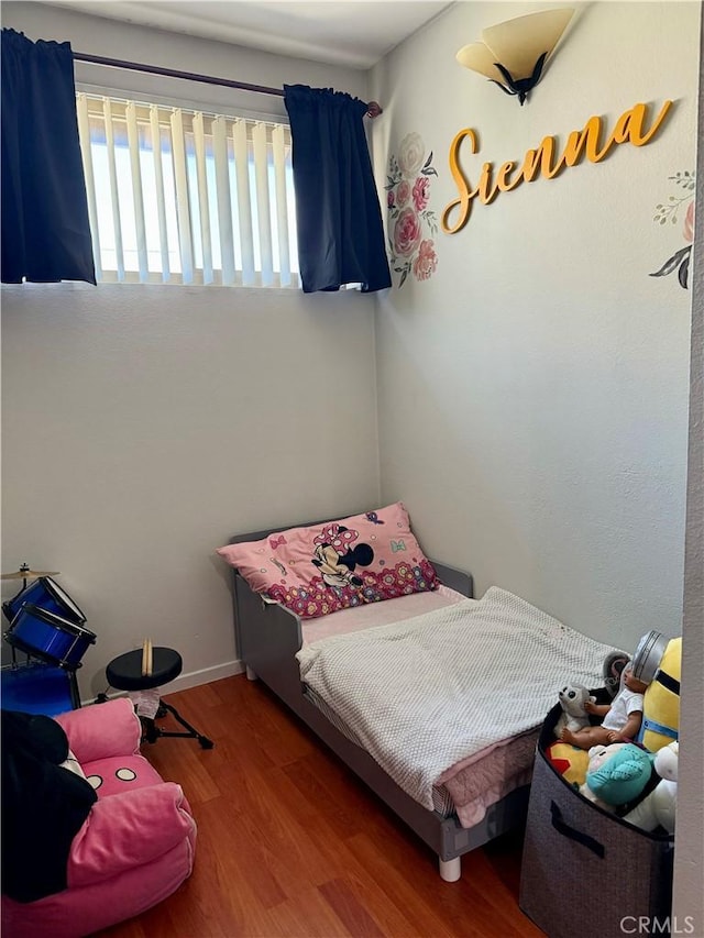 bedroom featuring hardwood / wood-style floors