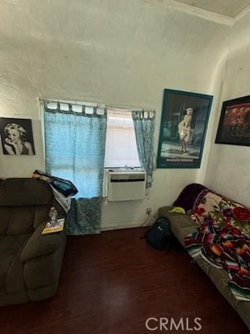 interior space with crown molding and dark wood-type flooring