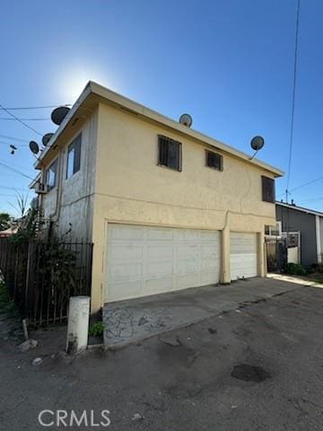 view of side of property featuring a garage