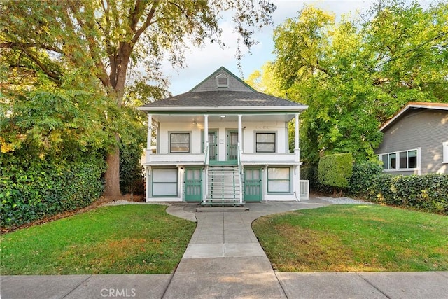 exterior space featuring a porch and a front lawn