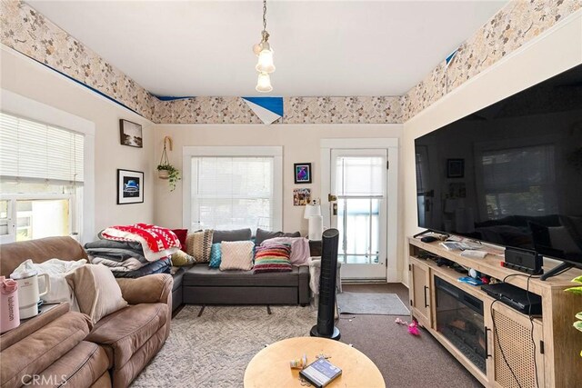 carpeted living room featuring a wealth of natural light