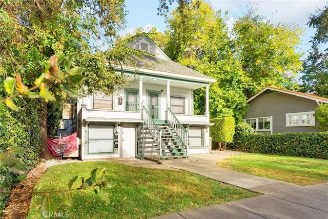 view of front of property with a front lawn and a porch