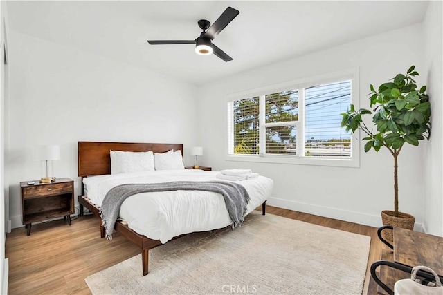 bedroom featuring ceiling fan and light hardwood / wood-style floors