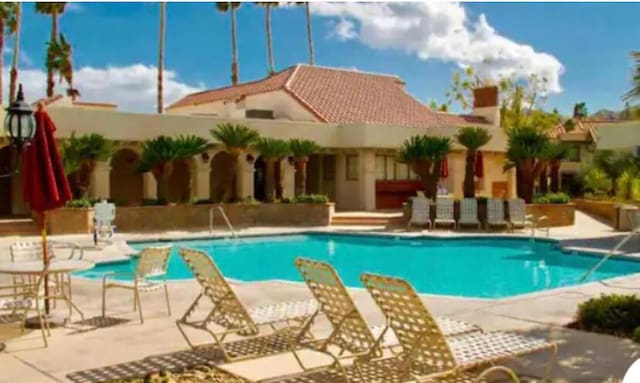 view of pool featuring a patio area