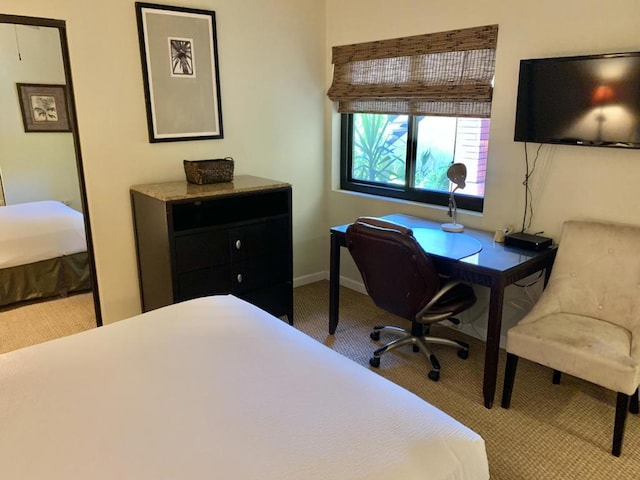 bedroom featuring light colored carpet