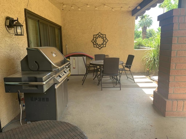 view of patio featuring a grill