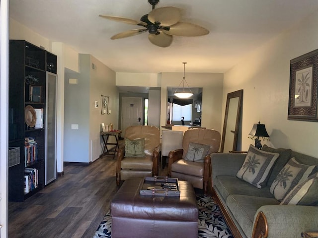 living room with dark hardwood / wood-style floors and ceiling fan