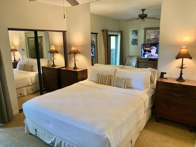 bedroom featuring ceiling fan and light carpet