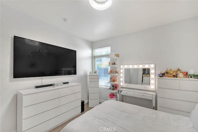 bedroom featuring wood finished floors