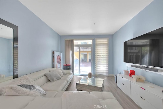 living room with light wood-style floors and baseboards